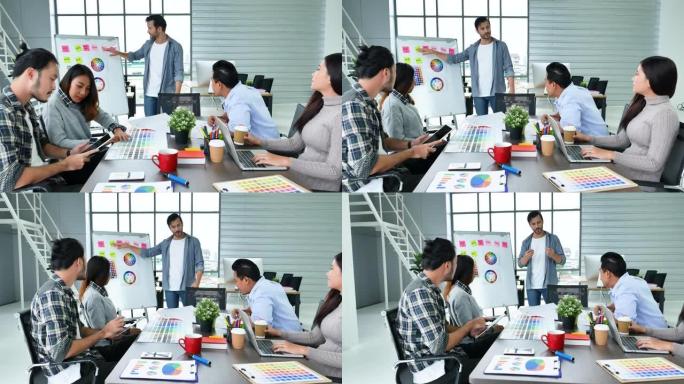 多元化办公室团队创意代理会议呈现设计理念年轻创业集团商务人士。休闲设计师团队计划讨论沟通商务人员一起