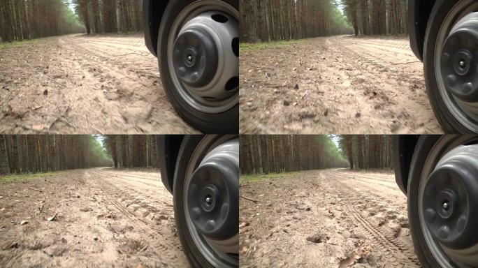 Car wheels on a road. Front view lateral perspecti