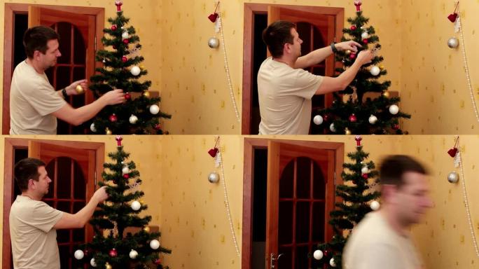 男人在家里安装所有圣诞树