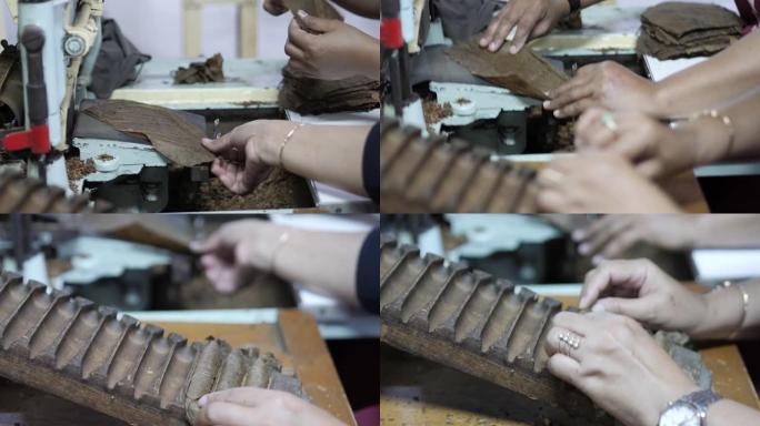 生产自制雪茄的雪茄工厂内的传统雪茄卷烟机