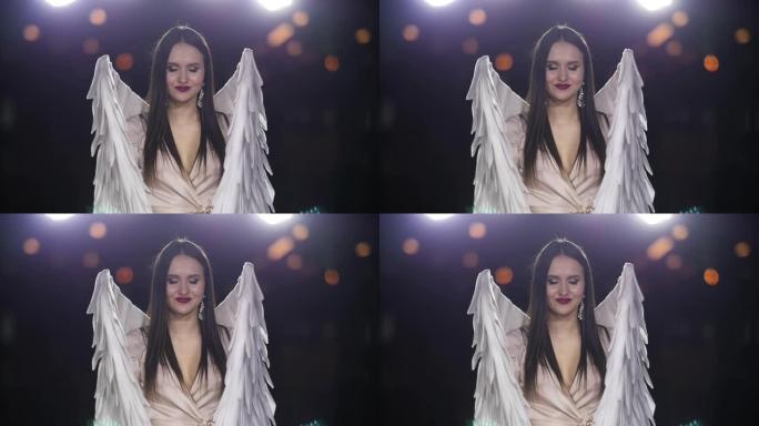 可爱的女人天使服装翅膀梦想特写性感的视觉慢动作。