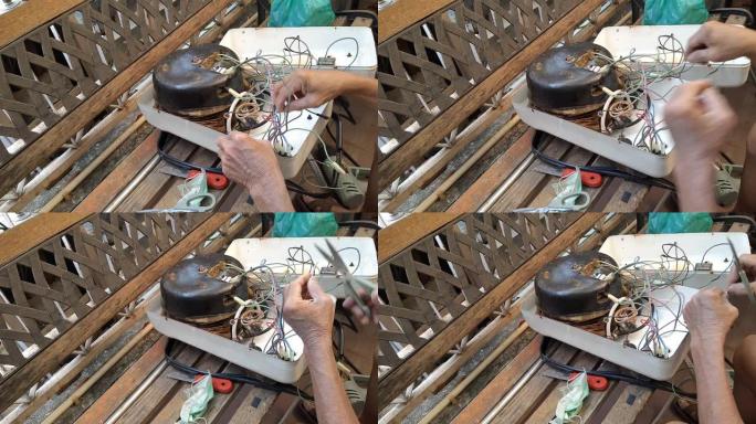 技术员修理破损的蒸汽熨斗的镜头