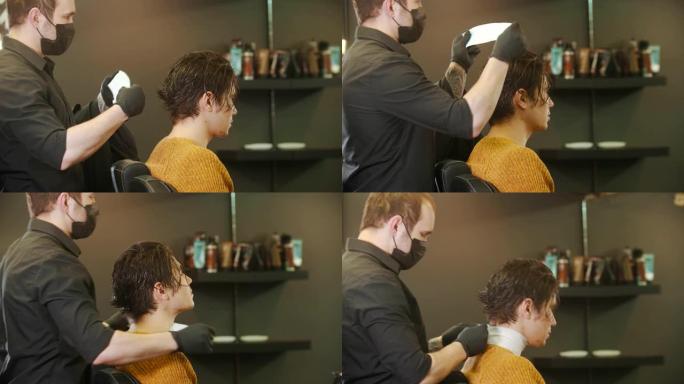 理发师在理发店为客户提供颈部保护