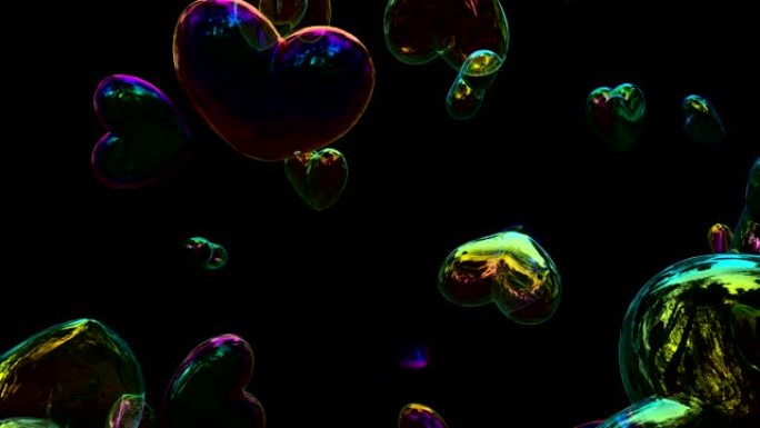 Heart shaped soap bubbles floating and bursting at