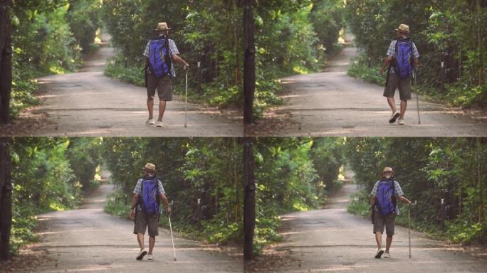 亚洲高级男性走路时的场景，他在假期，放松的时刻，开心快乐。户外自然日常生活的概念