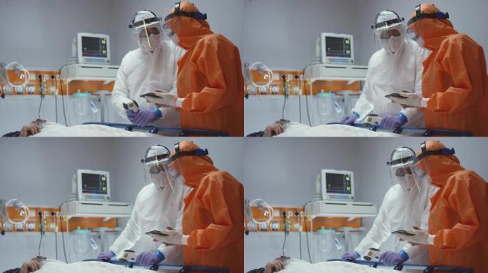慢动作: 护士测量冠状病毒病人的体温，并咨询领先的医生-多莉射击。在5K R3D中拍摄