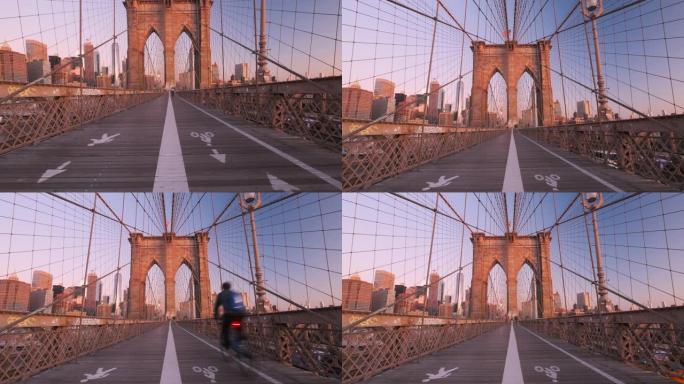 人们沿着布鲁克林大桥上的人行小径行走和锻炼，这条大桥连接着东河上的曼哈顿纽约