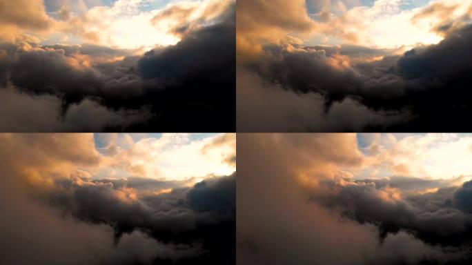 在日落时云层以上的傍晚雨云中进行跨度相机拍摄。云中的精彩飞行。鸟瞰图