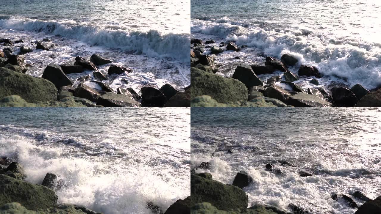 岩石海岸上的波浪。慢动作