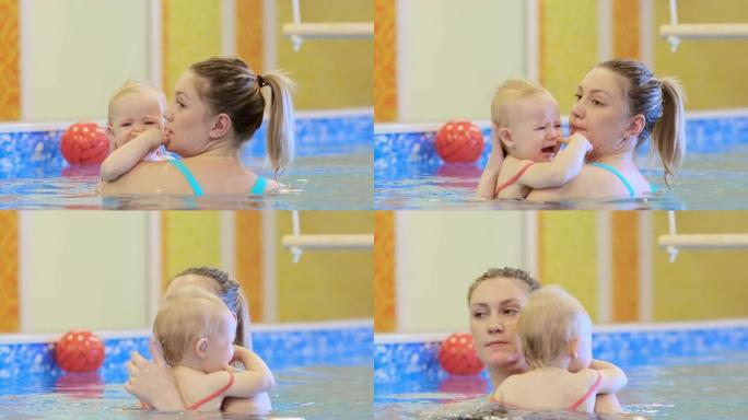 游泳池里有教练的女孩哭了，想见她妈妈