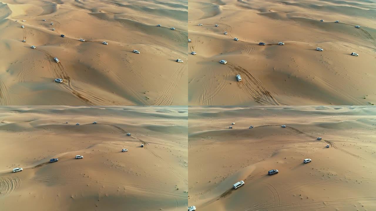 阿拉伯沙漠深处4x4越野车沙丘扑打的美丽空中无人机视图