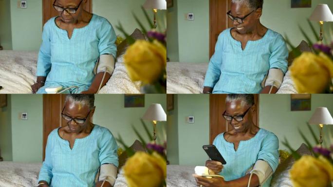 非裔美国高级妇女用手机扫描血压读数