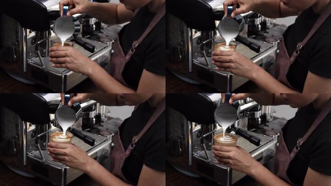 咖啡师用牛奶泡沫制作拿铁艺术