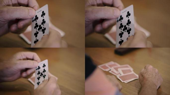 扑克牌—一个人拿着梅花9
