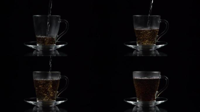 将沸水倒入玻璃茶杯中，在黑色背景上倒入一部分茶，慢动作