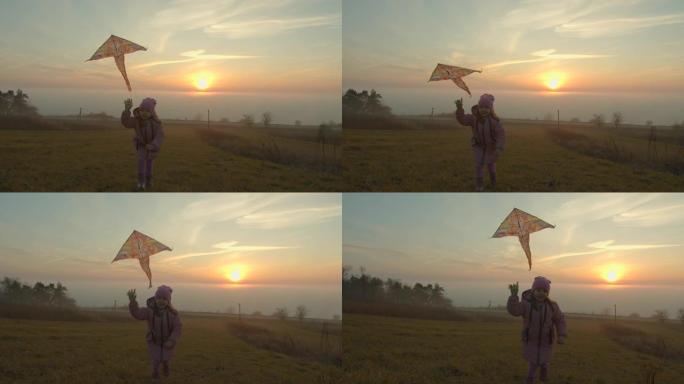 一个小女孩抱着风筝在空中奔跑，微笑着。雾上方的太阳。4k超高清