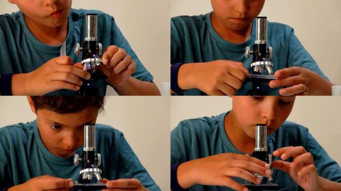 一个严肃的男孩调节显微镜的特写