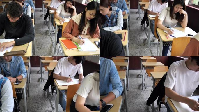 亚洲学生参加考试一排教室作答