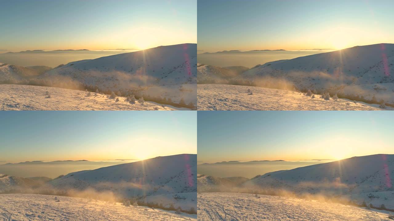 宁静全景中的薄雾雪山山峰日出