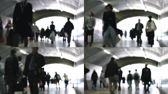 在火车站附近的东京市中心，高峰时段，行人在隧道下行走的4k视频