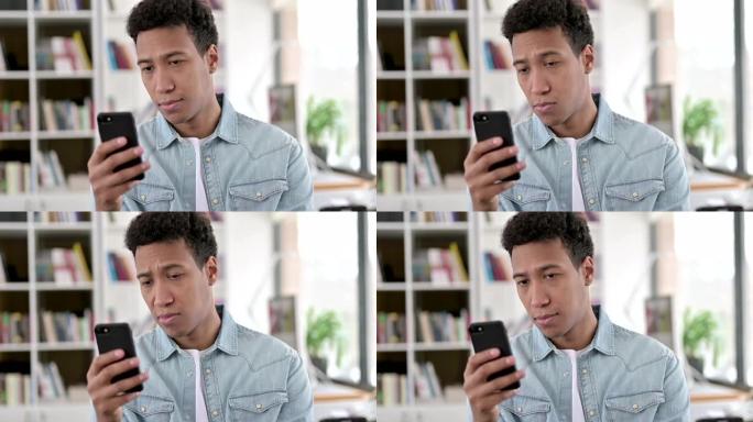 年轻的非洲裔美国人使用智能手机，浏览互联网