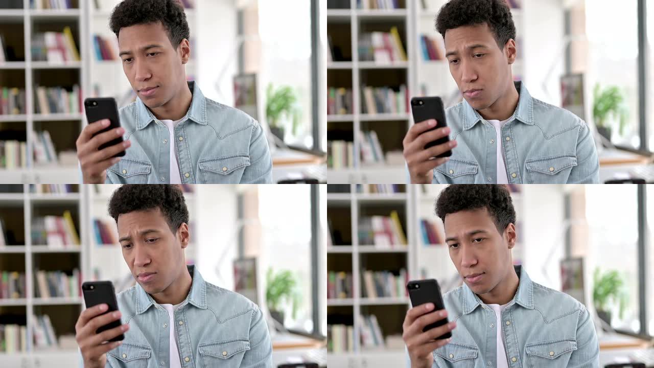 年轻的非洲裔美国人使用智能手机，浏览互联网