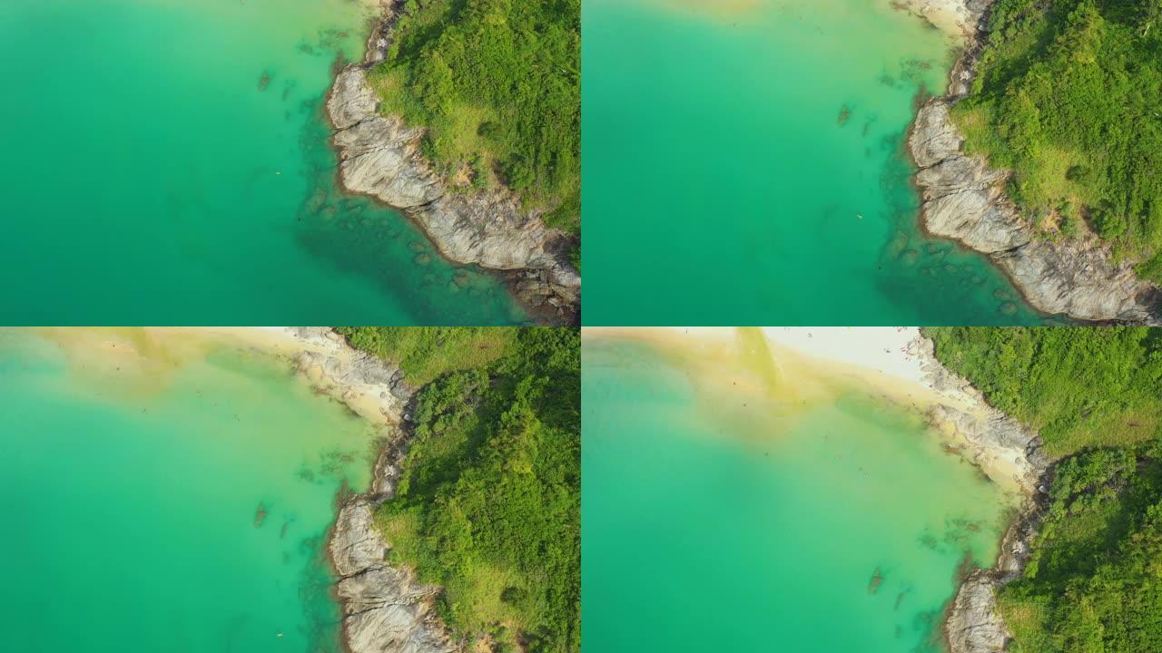 人们在普吉岛享受游泳和放松的海滩泰国巴东海滩是普吉岛一个非常著名的旅游目的地4k鸟瞰图无人机自上而下