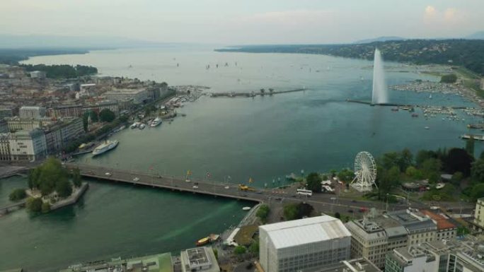 日落阳光明媚的天空日内瓦市著名的湖喷泉湾空中全景4k瑞士