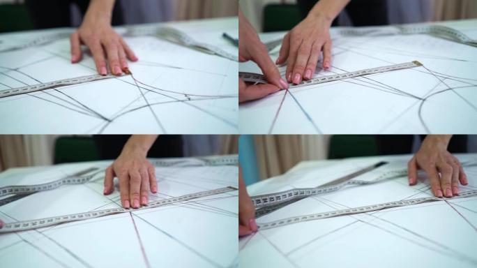 女性用卷尺检查缝纫图案上的标记