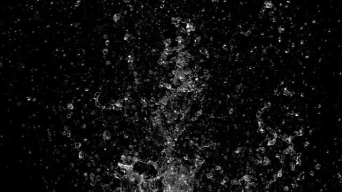 黑色背景上水花抽象粒子的慢动作