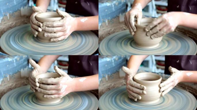 陶艺班作坊。陶工轮子上的粘土造型。波特向孩子们传授手艺