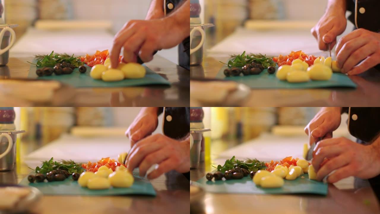 在厨房板上用刀煮切土豆和切碎土豆