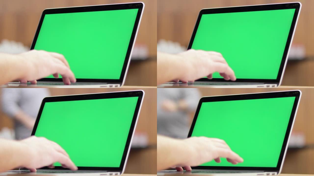 办公室桌上使用色度键屏幕笔记本电脑特写镜头的4k视频