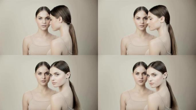 两个裸体化妆的双胞胎女孩。