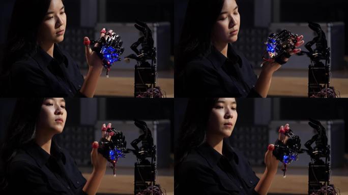 亚洲青少年工程师在实验室组装和测试机器人手臂反应。学生工程师编程控制器电路同步技术与协作开发机器人。