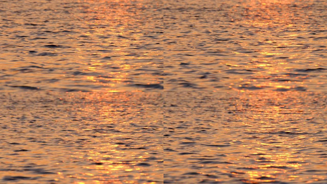 海水背景。海上的小浪。海面背景。平静的海水。月亮在水中反射。夕阳灯在水中反射。冥想概念。岩浆颜色调色