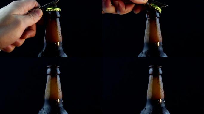 酒保打开一瓶迷雾的黑啤酒。一个年轻人的手打开一瓶冷的黑啤酒。