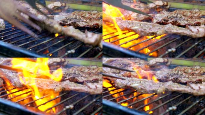 肉排掉落在火焰爆发的烤架上