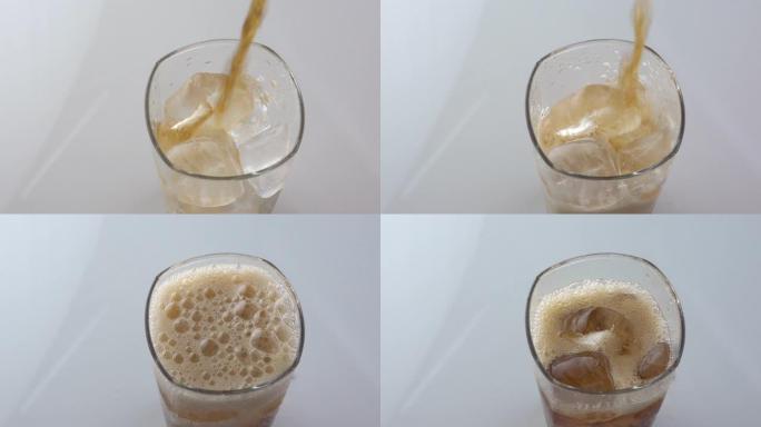 冷清爽的可乐倒入白色背景上带有冰的玻璃杯中，并留有文字空间。冰凉饮料含咖啡因