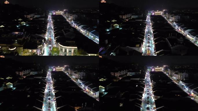 夜间照明杭州市著名行人拥挤街道区域空中全景4k中国
