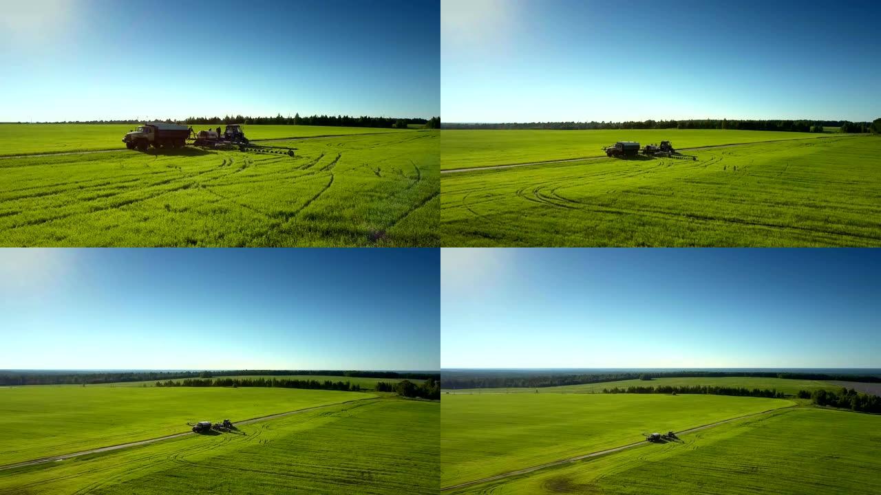 flycam上升到农业设备上方显示出广阔的景观