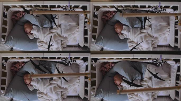 初生婴儿在婴儿床中熟睡