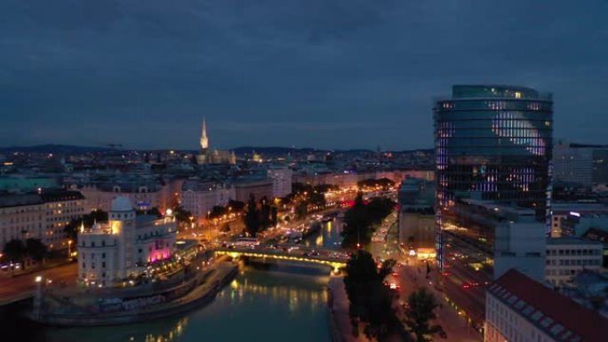 黄昏时间照明维也纳城市著名的河边夜生活交通桥空中全景4k奥地利