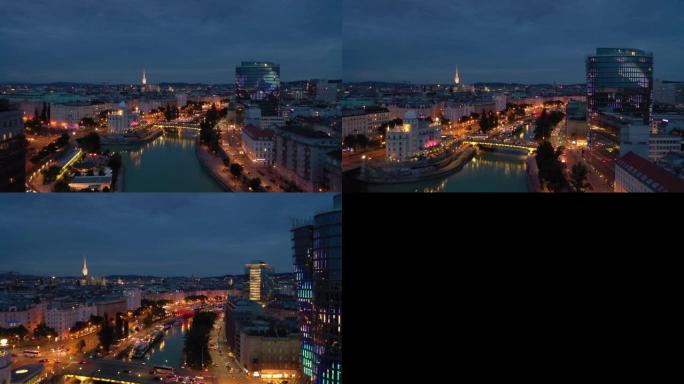 黄昏时间照明维也纳城市著名的河边夜生活交通桥空中全景4k奥地利