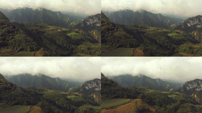 空中拍摄一座被神秘包围的山。无人机的观点，在雾中的塞尔维亚山。
