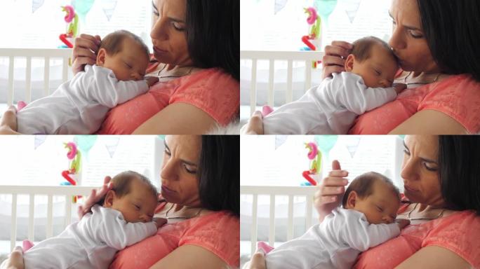 母亲亲吻和爱抚她的新生婴儿，同时让她小睡