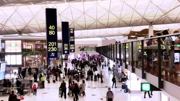 4k时间流逝: 拥挤的乘客在香港机场航站楼行走