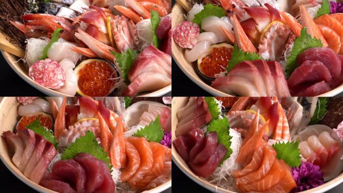 日本食物生鱼片将晚餐放在转盘上。