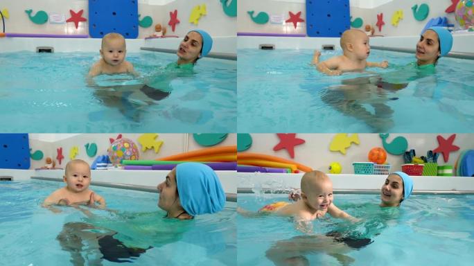 一个快乐的幼儿在儿童游泳池与教练一起学习游泳和游泳的特写镜头。他环顾四周，微笑着。婴儿游泳。概念