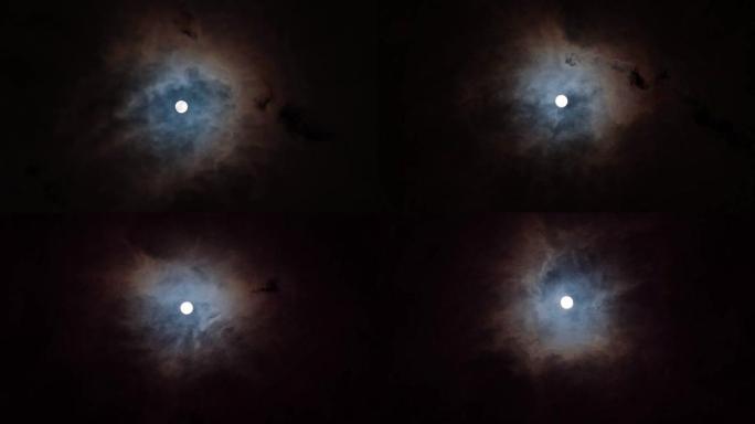 明亮的满月，夜晚有移动的云层背景，4k镜头，时间流逝，月光照亮的云层。